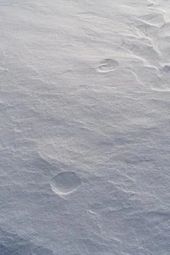 Shapes, textures, patterns created by snow and wind. Stock Photos