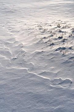 Shapes, textures, patterns created by snow and wind. Stock Photos