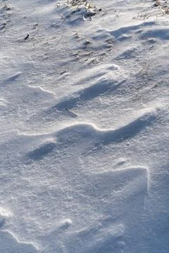 Shapes, textures, patterns created by snow and wind. Stock Photos