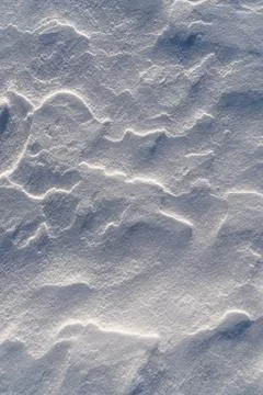 Shapes, textures, patterns created by snow and wind. Stock Photos