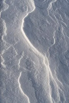 Shapes, textures, patterns created by snow and wind. Stock Photos