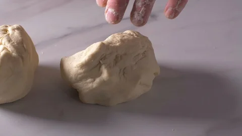 Shaping dough balls with hands Stock Footage 106153864