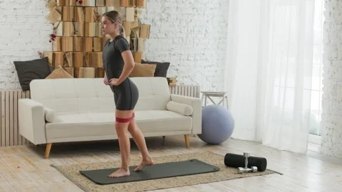 Shaping figure and training buttocks. Young fit woman in sportswear doing Vídeos de archivo 303766676