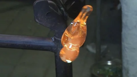 Shaping Glowing Molten Glass During Traditional Glassblowing Stock-Footage 345133992