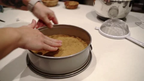 Shaping graham cracker pie crust inside of springform pan Stock Footage 222166467