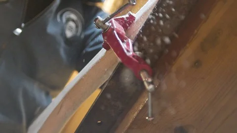 Shaping the handle of an axe, flying sawdust Stock Footage 129695316