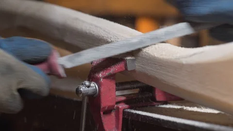 Shaping the handle of an axe Stock Footage 129694055