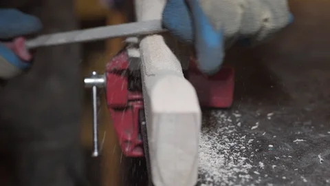 Shaping the handle of an axe Stock Footage 129694094