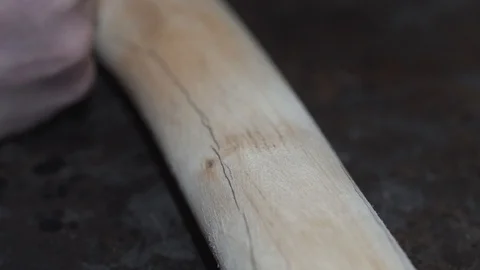 Shaping the handle of an axe Stock Footage 129695301