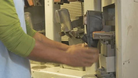 Shaping a leather shoe on a machine Stock Footage 108477107