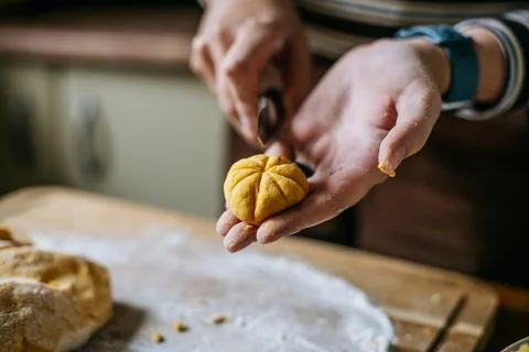 Shaping pumpkin gnocchi by hand Stock Photos