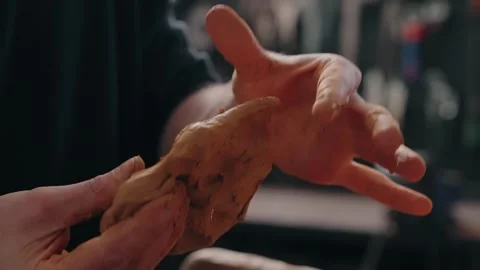 Shaping softness with bare hands in quiet devotion Stock-Footage 308626008