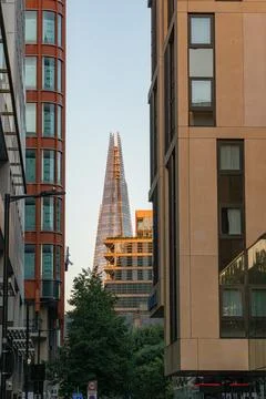 The Shard Skyscraper Framed Between Modern Buildings in London Stock Photos