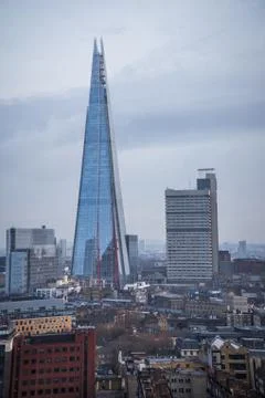 The Shard skyscraper with grey clouds in the sky. Stock Photos