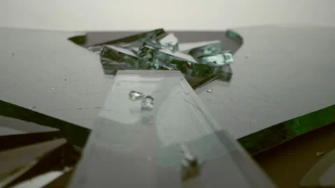 Shards of broken glass piled in a pile onlight background. Stock Footage 143849688