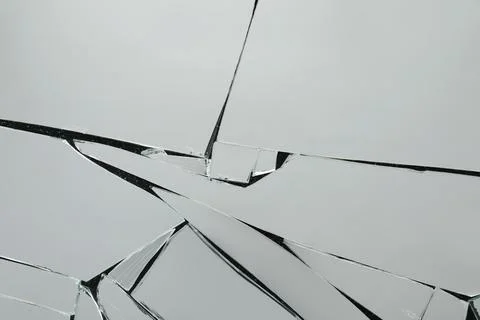Shards of broken mirror on dark background, top view Foto stock