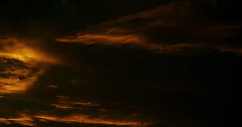Shards of cirrus clouds neon illuminated in heavy shadow. Stock Footage 344716084