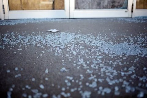Shards of shattered glass on a sidewalk Stock Photos