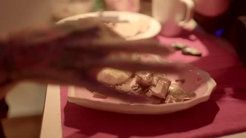  share dessert with hands skilled hand delicately cuts a beautifully arranged di Stock Footage 291932582