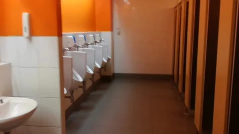 Shared bathroom,A clean men's communal bathroom at work Stock Footage 140765404