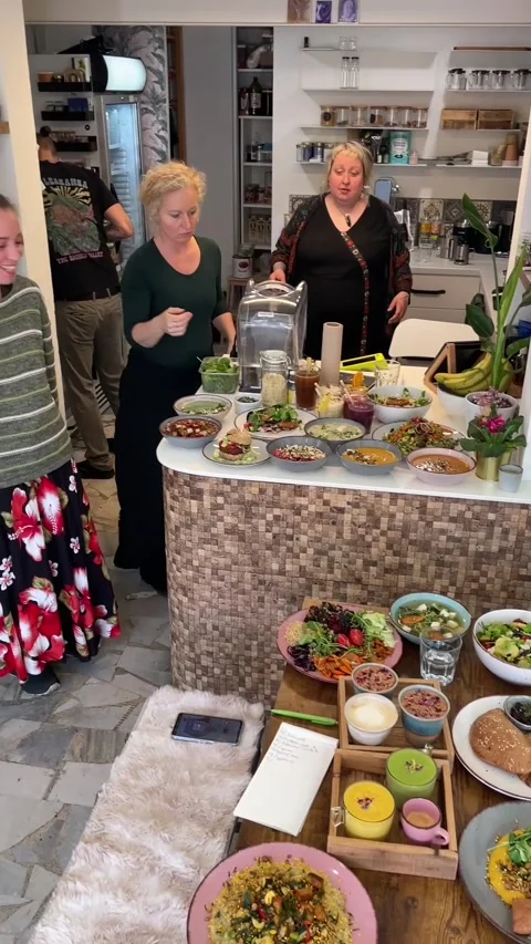 Shared feast with friends. Joyful communal dining with diverse dishes Stock Footage 335365641