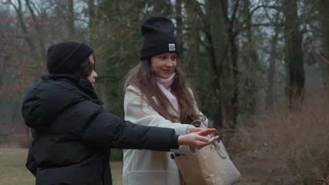 A shared learning moment: mother and son discuss a bird they are feeding Stock Footage 312335246
