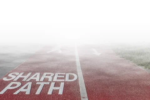 Shared Path sign written on footpath for cyclists and pedestrians disappearin Stock Photos