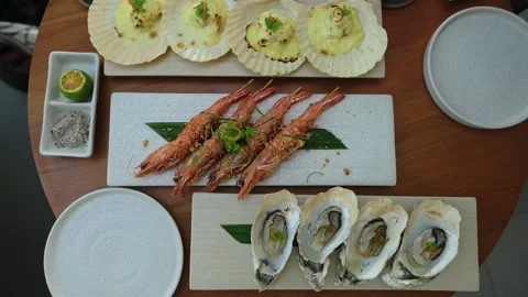 Shared Shellfish With Citrus Flair. Overhead View Of Mixed Shellfish And Citrus Видео 332686755