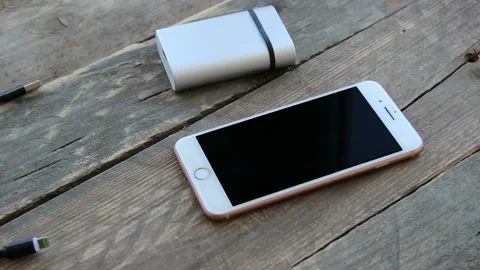 Сharging wire connects to the phone Stock Footage 133135812