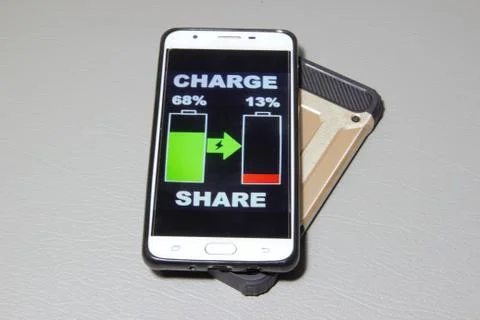 Sharing charge between charge share phones Stock Photos