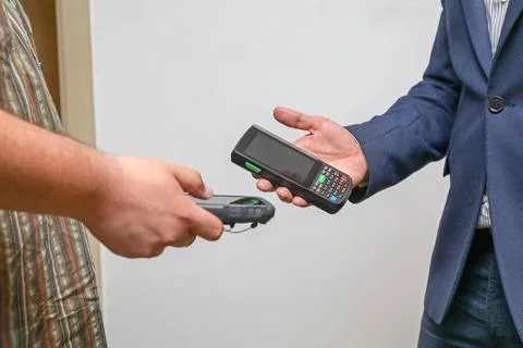 Sharing Data Two Man Synchronize Handheld Mobile Computers Copyright: xZoo... 写真素材