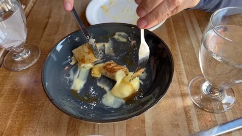 Sharing (equally) the 5th piece of lemon crepe. Stock Footage 333775902