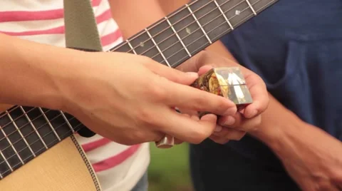 Sharing the evangecube with another person in a park in Cali Stock-Footage 54411879