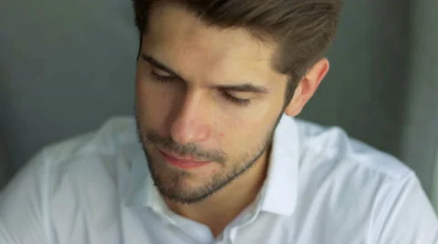Sharing good news. Side view of handsome young man talking on the mobile phone Stock Footage 68598473
