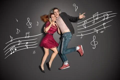 Sharing headphones. Stock Photos