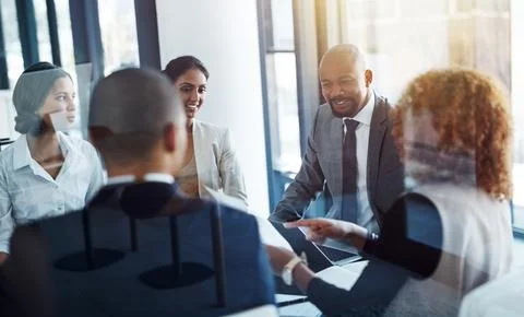 Sharing information for a synchronized work unit. a team of professionals having Stock Photos