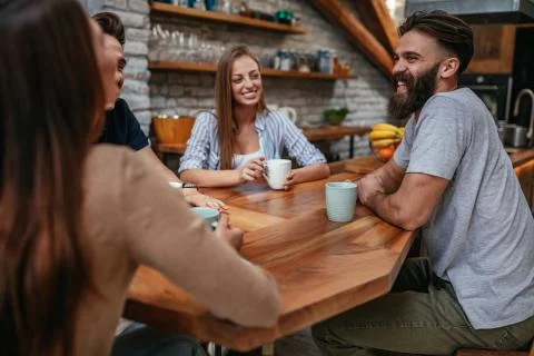 Sharing laughs over coffee Stock Photos