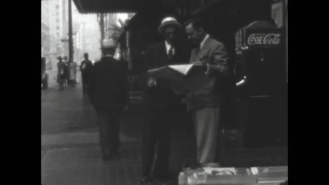 Sharing a Newspaper 1938 Stock Footage 167738402
