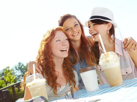 Sharing the springtime of their lives. A group of adolescent girls enjoying Stock Photos
