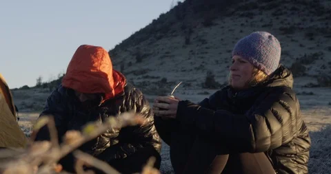 Sharing tea and enjoying the view while camping Stock Footage 90406074