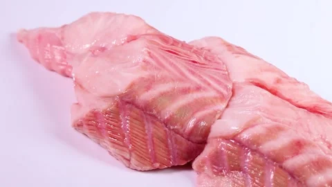 Shark fillet on white background, rotating Stock Footage 303251275