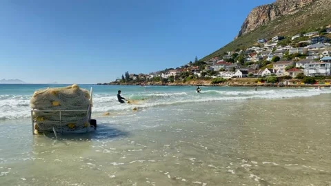 Shark net being deployed at Fish Hoek beach Stock Footage 160125077