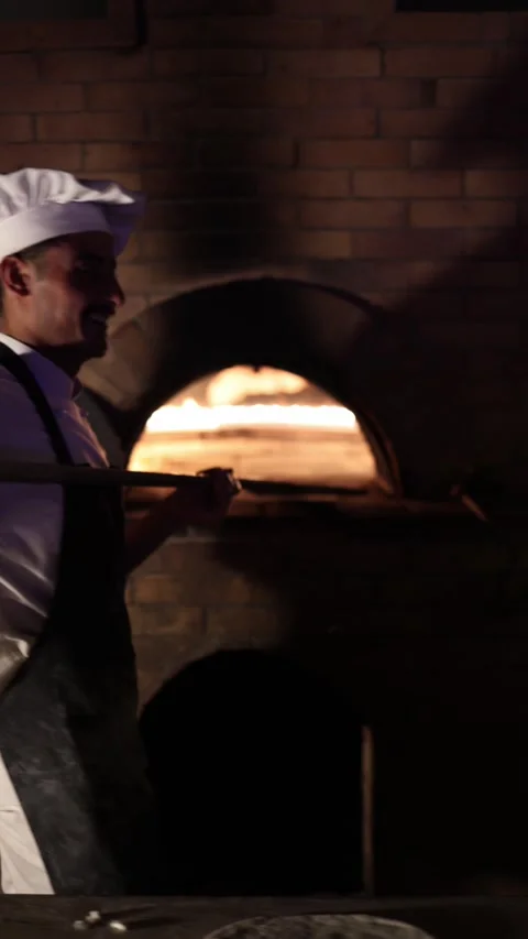 Sharm El Sheikh Egypt — May 6 2025 — Vertical screen — Smiling chef in white uni Stock Footage 311845522