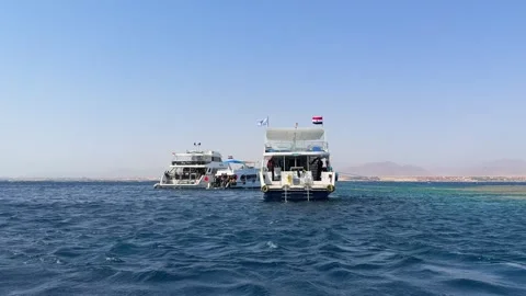 Sharm El Sheikh, Egypt - October 18, 2025: Tourist yachts with divers stopped Video stock 341837995