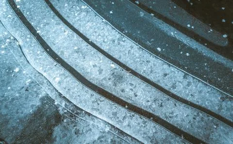 Sharp and clean lines of black and white stripes formed by ice and snow. The 스톡 사진