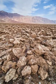 Sharp and eroded salt formations in salt flats of Death Valley Stock Photos