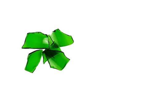 Sharp and jagged pieces of broken green glass cut out on a white background.. Stock Photos