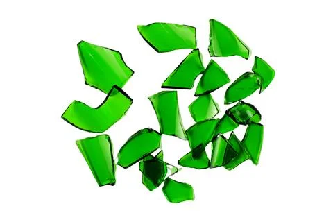 Sharp and jagged pieces of broken green glass cut out on a white background.. Stock Photos