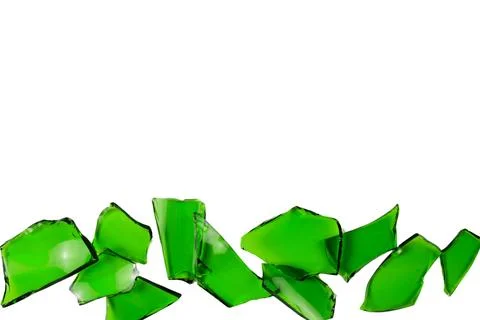 Sharp and jagged pieces of broken green glass cut out on a white background.. Stock Photos