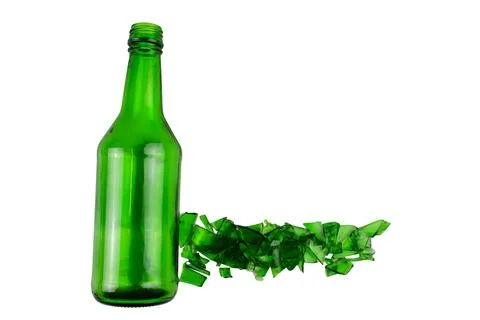 Sharp and jagged pieces of broken green glass cut out on a white background.. Stock Photos